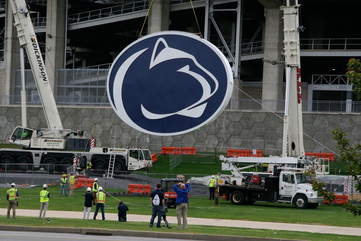 Crane lifting Penn State Logo for Beaver Stadium